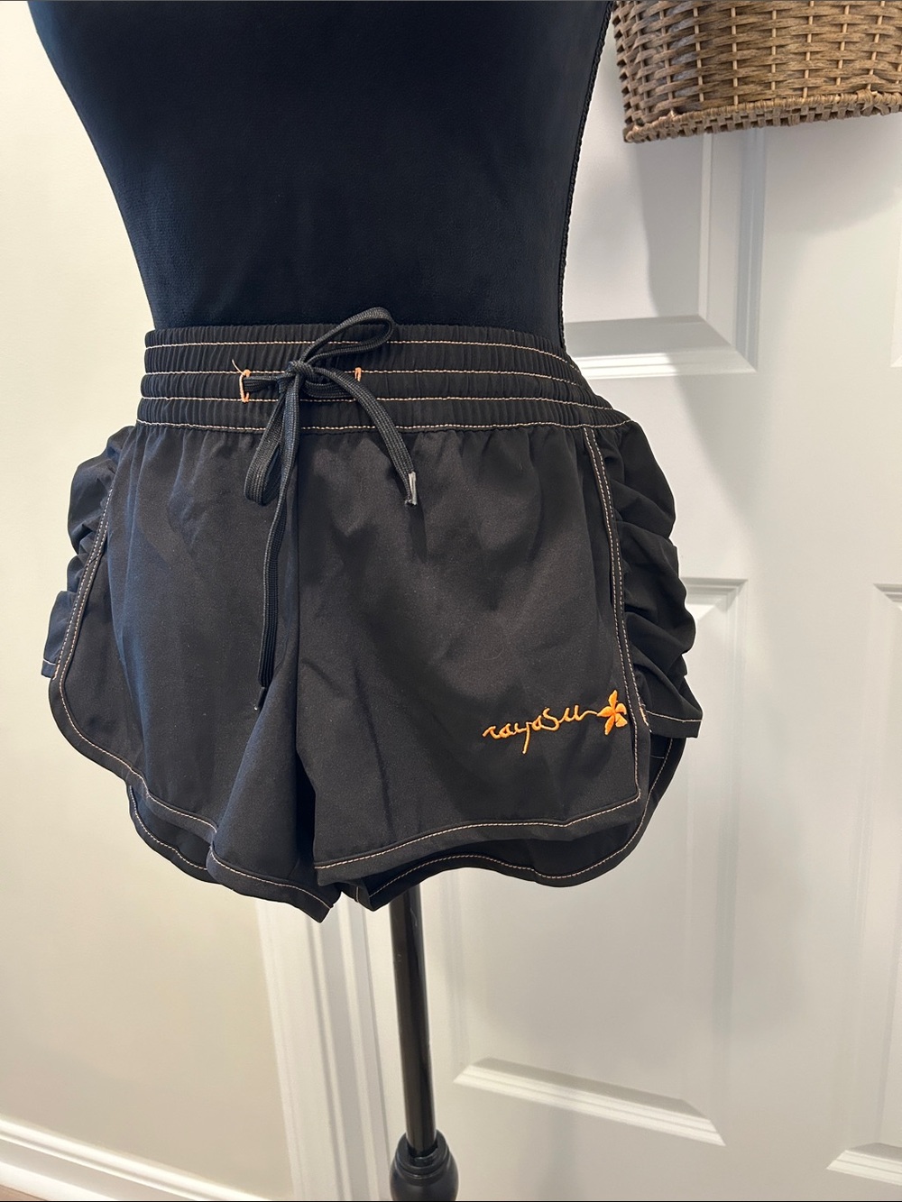 raya sun Women’s Black Athletic Shorts with Orange Logo Stitching. Size Large